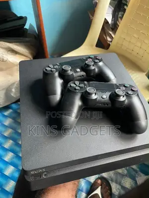 Used PlayStation 4 with 2 Controllers & 10 Games