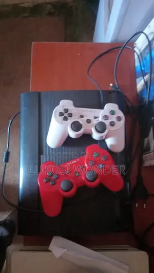 PS3 Super Slim Console with 2 Controllers and Games