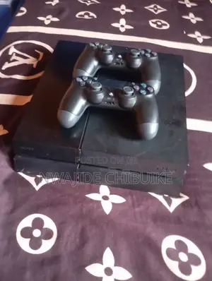 PlayStation 4 with Games and 2 Controllers