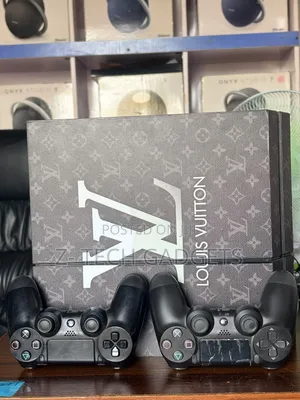 Used PS4 Fat Console with 2 Controllers & 7 Games